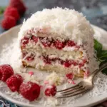 Raspberry Surprise Coconut Snowball Cake